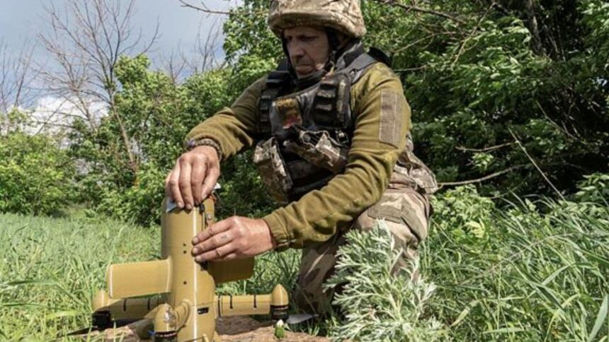 A Ukrainian soldier prepares an interceptor drone during a Russia's aerial attack at an undisclosed location near Kharkiv, Ukraine. (AP Photo)