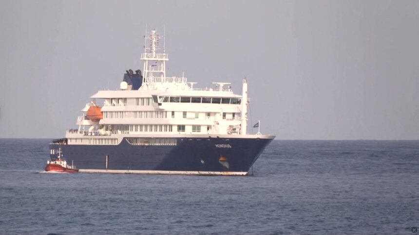 A boat beside cruise ship MV Hondius, hit by Hantavirus, anchored off Cape Verde port, on the day sick passengers were evacuated by boat from the cruise ship, in Praia Port, Cape Verde, in this screengrab obtained from a video, May 5, 2026. (REUTERS)