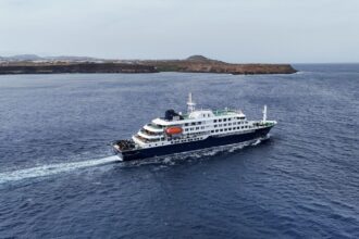 A drone view of the cruise ship MV Hondius, carrying passengers suspected of having cases of hantavirus on board, leaves Praia, Cape Verde, May 6, 2026. (REUTERS)