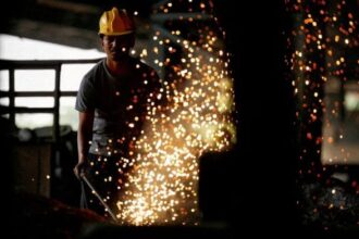 An employee works at a steel processing production line of a factory in Mandi Gobindgarh in the northern state of Punjab, India, October 19, 2024 | Reuters file photo