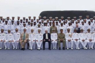 Pakistani and Chinese officials pose for a group photo during the commissioning ceremony of PNS Hangor in Sanya, China, on 30 April | Source: X, @PresOfPakistan)
