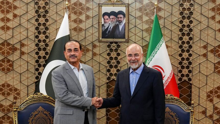 Iran's Parliament Speaker Mohammad Bagher Qalibaf, right, shakes hands with Pakistans Army Chief Field Marshal Gen. Asim Munir during their meeting in Tehran, on Sunday. (AP)