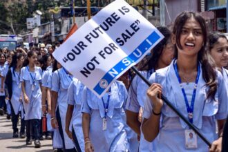 School students join an NSUI protest rally against the alleged NEET scam and the Union government, in Chikkamagaluru, Karnataka, Monday, May 25, 2026. (PTI Photo)