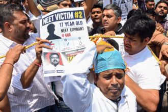 Indian Youth Congress (IYC) activists protest against Union Minister Dharmendra Pradhan over the alleged NEET-UG 2026 paper leak at Teen Murti Circle, in New Delhi on Saturday. (ANI Photo)