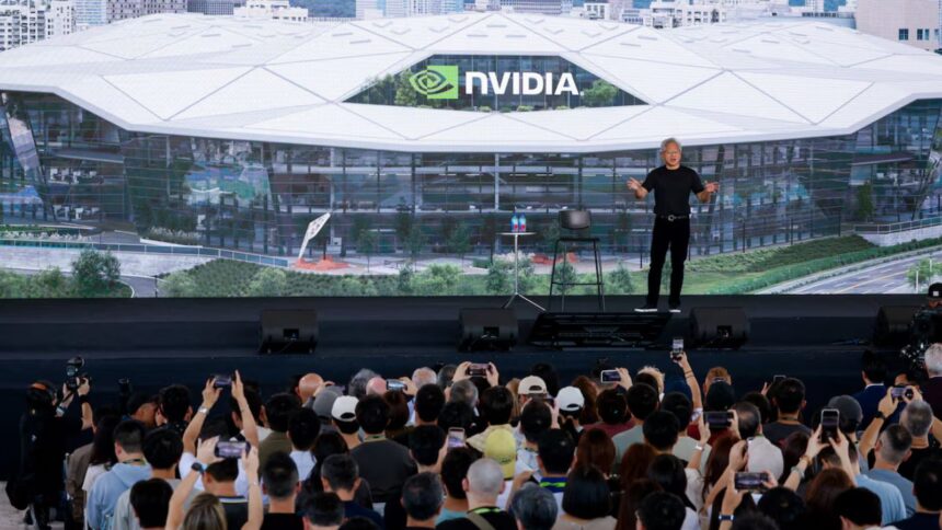Nvidia CEO Jensen Huang stands in front of the design of its new headquarters displayed on a screen at the Constellation All-Employee Celebration in Taipei, Taiwan, May 27, 2026. (Image: Reuters/Ann Wang)