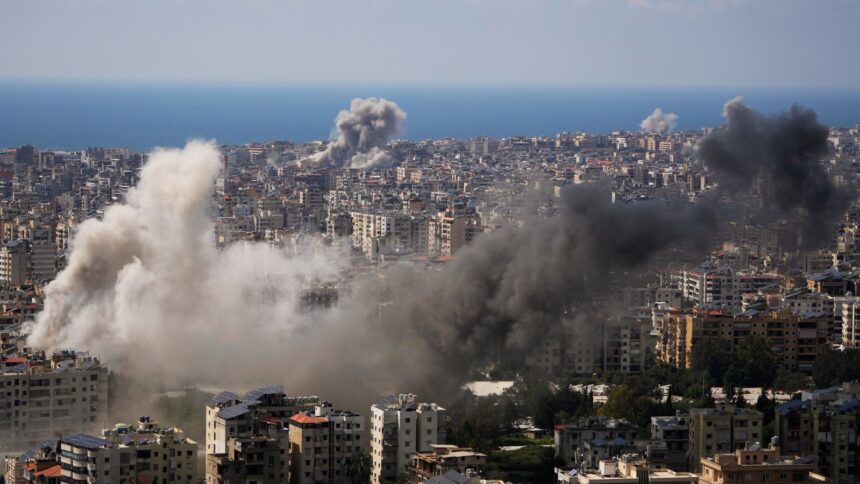 Smoke rises following several Israeli airstrikes that hit without previous warning Beirut's southern suburbs and central Beirut, Lebanon. (AP Photo)