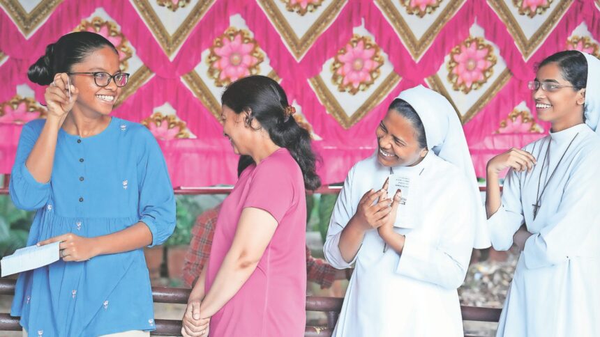 People wait in a queue to cast their votes during the Puducherry Assembly elections on April 9 (PTI Photo)