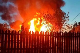This photo released by Moscow Region Governor Andrei Vorobyev's official telegram channel shows a house on fire after a Ukrainian attack in Khimki, just outside Moscow, Russia, on Sunday, May 17, 2026.