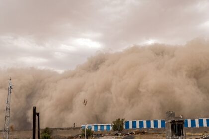 A colossal dust cloud rolled across Churu, creating apocalyptic scenes as strong winds carried sand across the landscape.