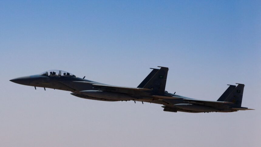 A Saudi fighter jet accompanies Air Force One, carrying US President Donald Trump, on approach to the King Khalid International Airport in Riyadh, Saudi Arabia, May 13, 2025. (REUTERS)