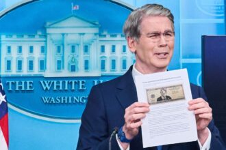 Treasury Secretary Scott Bessent holds up an image of the proposed 250 dollar bill, while speaking to reporters in the James Brady Press Briefing Room at the White House. (AP Photo)