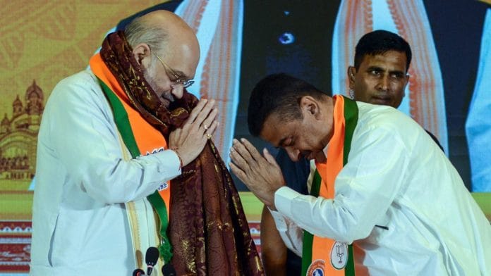 File photo of Union Home Minister Amit Shah and Suvendu Adhikari at launch event of BJP's manifesto in Kolkata on 10 April | ANI