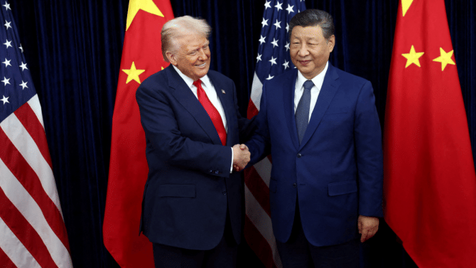 File photo of US President Donald Trump greeting Chinese President Xi Jinping as they held a bilateral meeting on the sidelines of APEC summit, in Busan, South Korea. | Reuters