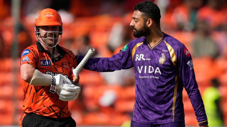 Kolkata Knight Riders' Varun Chakaravarthy pats Sunrisers Hyderabad's Travis Head after taking his wicket during the Indian Premier League cricket match between Sunrisers Hyderabad and Kolkata Knight Riders in Hyderabad , India, Sunday, May 3, 2026. (AP Photo)