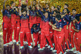 RCB lifting trophy