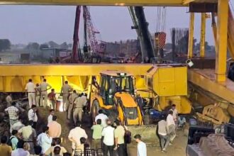 A crane overturned during the construction of the Jewar Airport flyover near Pahneda Khurd, in Faridabad on Thursday. Rescue operations are ongoing. (ANI Video Grab)