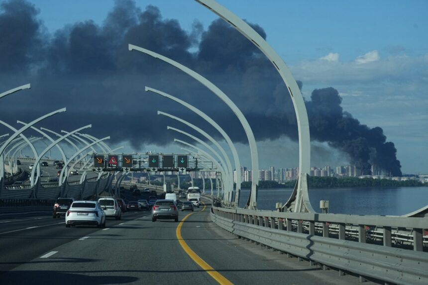 Smoke rises over St Petersburg after Ukrainian drone strikes.