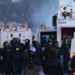 Police use water-cannons to disperse protesters near Newtownabbey, in Belfast, Wednesday, June 10, 2026, following a stabbing incident on Monday night. (AP Photo)