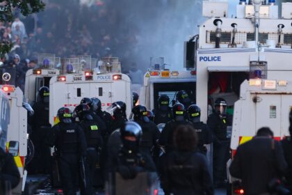 Police use water-cannons to disperse protesters near Newtownabbey, in Belfast, Wednesday, June 10, 2026, following a stabbing incident on Monday night. (AP Photo)