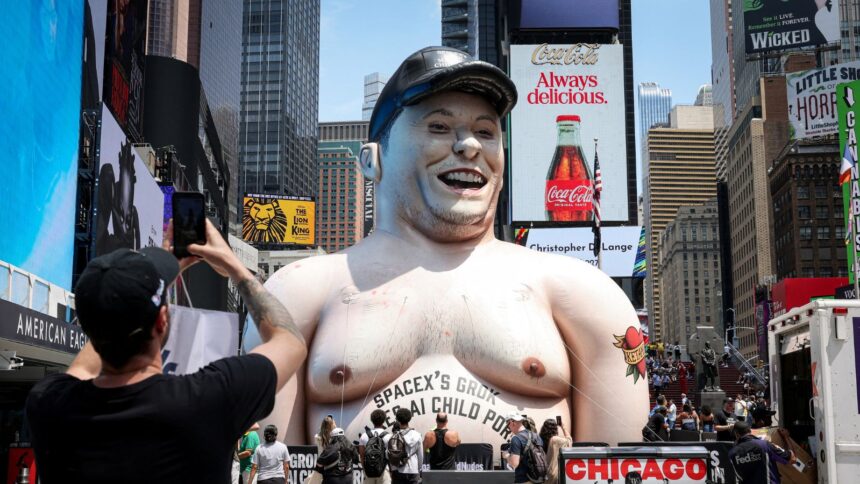 A giant inflatable caricature of Elon Musk stands in Times Square criticizing Grok, the artificial intelligence chatbot developed by xAI, in New York City, on June 11, 2026. (REUTERS)