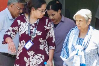 Giribala Singh, mother-in-law of Twisha Sharma, being taken out of the CBI office by officials in connection with the Twisha Sharma death case, in Bhopal on Tuesday. She will be produced before the court shortly. (ANI Photo)