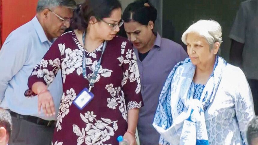 Giribala Singh, mother-in-law of Twisha Sharma, being taken out of the CBI office by officials in connection with the Twisha Sharma death case, in Bhopal on Tuesday. She will be produced before the court shortly. (ANI Photo)