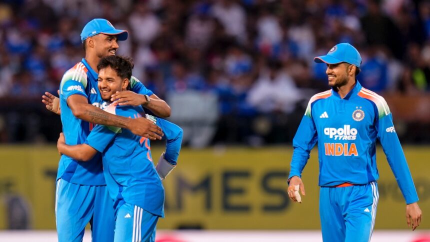 Harsh Dubey, centre, celebrates with Gurnoor Brar, left, and captain Shubman Gill after taking the wicket of Afghanistan's captain Hashmatullah Shahidi in the first ODI. (PTI Photo)