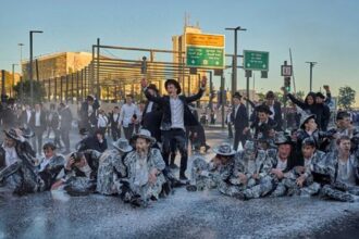 Israeli mounted police disperse Ultra-Orthodox Jews blocking a road during a protest against the army draft in Jerusalem