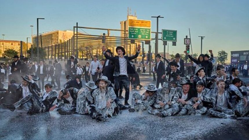Israeli mounted police disperse Ultra-Orthodox Jews blocking a road during a protest against the army draft in Jerusalem