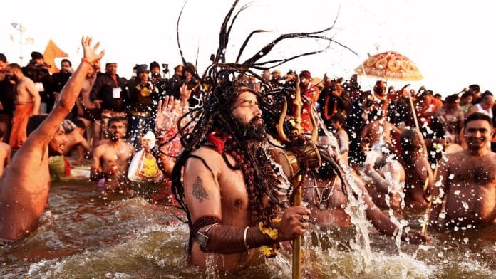 An ascetic taking a dip at Ganga River during Maha Kumbh Mela | Wikimedia Commons