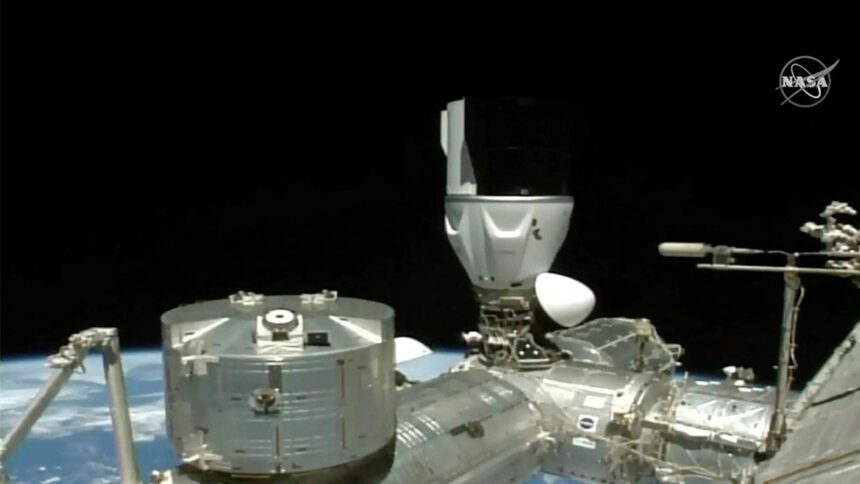 In this image from NASA TV, a SpaceX capsule carrying four astronauts docks at the International Space Station Friday, March 3, 2023. A new crew arrived at the International Space Station on Friday for a six-month mission, after overcoming trouble with one of the capsule’s docking hooks. (NASA TV via AP)
