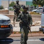 Israeli security forces are deployed at the scene of a shooting attack carried out by a Palestinian citizen of Israel near Tzur Yitzhak in central Israel, Sunday, June 7, 2026. (AP Photo)
