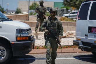 Israeli security forces are deployed at the scene of a shooting attack carried out by a Palestinian citizen of Israel near Tzur Yitzhak in central Israel, Sunday, June 7, 2026. (AP Photo)