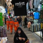 Pedestrians walk through Tajrish Bazaar in Tehran, Iran, Tuesday, April 7, 2026. (AP Photo)