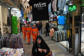 Pedestrians walk through Tajrish Bazaar in Tehran, Iran, Tuesday, April 7, 2026. (AP Photo)