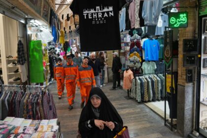 Pedestrians walk through Tajrish Bazaar in Tehran, Iran, Tuesday, April 7, 2026. (AP Photo)
