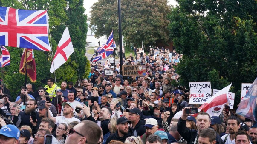 People gather to protest outside Southampton police station, Southampton, England, Tuesday June 2, 2026, after the fatal stabbing of Henry Nowak, a British teenager who was handcuffed despite claiming he was the crime victim.