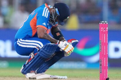 India's captain Suryakumar Yadav takes a breather after getting hit by a delivery from South Africa's Lungi Ngidi during the T20 World Cup cricket match between India and South Africa in Ahmedabad. (AP Photo)