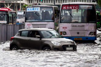 Thiruvananthapuram: Vehicles wade through a waterlogged road after rainfall, in Thiruvananthapuram, Kerala, Saturday, May 30, 2026. (PTI Photo)