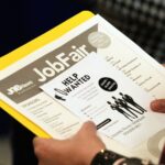 A job seeker waits to talk to a recruiter at a job fair in Sunrise, Florida (AP File Photo)