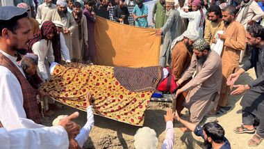 People move the bodies of victims killed in what the Taliban said was a Pakistani airstrike, before their burial in Kunar province, Afghanistan, on September 21, 2026. REUTERS/Stringer