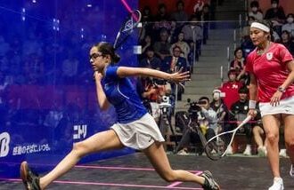 India's Anahat Singh (L) competes against Japan's Satomi Watanabe during the women's singles semifinal squash match.