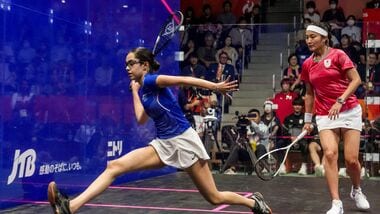 India's Anahat Singh (L) competes against Japan's Satomi Watanabe during the women's singles semifinal squash match.