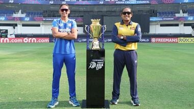 India captain Harmanpreet Kaur (L) and Sri Lanka skipper Chamari Athapaththu pose with the series trophy in Dubai on Saturday.