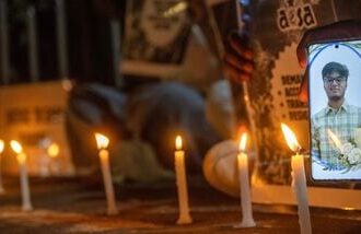 Students hold candles in memory of Sahil Wakode, a second-year IIT Bombay student who died by suicide, during a candlelight tribute