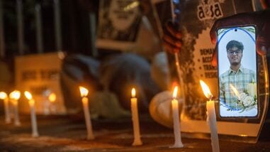 Students hold candles in memory of Sahil Wakode, a second-year IIT Bombay student who died by suicide, during a candlelight tribute