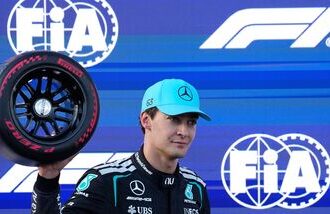 Mercedes driver George Russell of Britain celebrates after he clocked the fastest time during the qualifying session for the Azerbaijan F1 Grand Prix, in Baku, Azerbaijan.