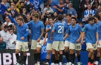 Brighton players celebrate first goal during the English Premier League soccer match between Brighton & Hove Albion and Arsenal in Brighton, England.