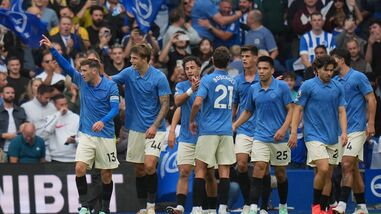 Brighton players celebrate first goal during the English Premier League soccer match between Brighton & Hove Albion and Arsenal in Brighton, England.