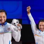 Mirabai Chanu holds a silver medal after competing in the Women's 49kg Group A weightlifting final match during the 20th Asian Games, in Nagoya, Japan.